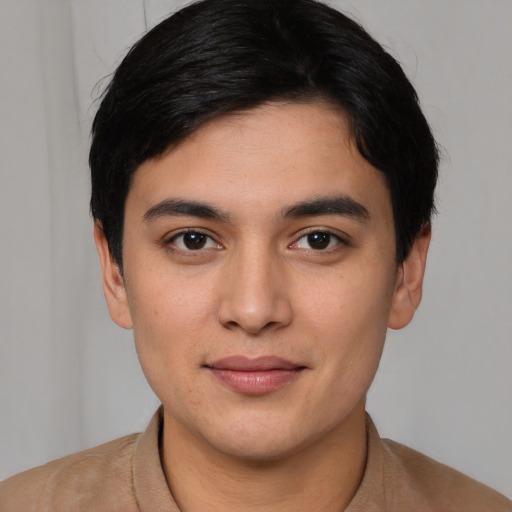 Joyful asian young-adult male with short  black hair and brown eyes