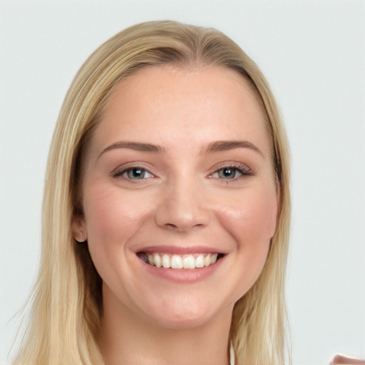 Joyful white young-adult female with long  brown hair and blue eyes