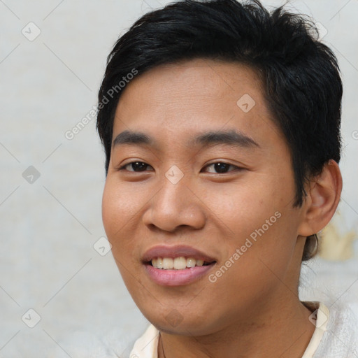 Joyful asian young-adult male with short  black hair and brown eyes