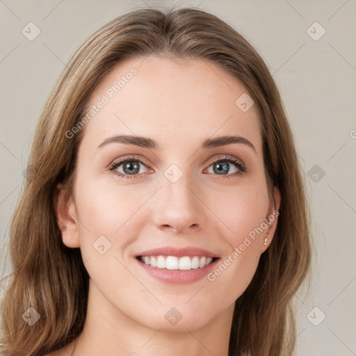 Joyful white young-adult female with long  brown hair and green eyes