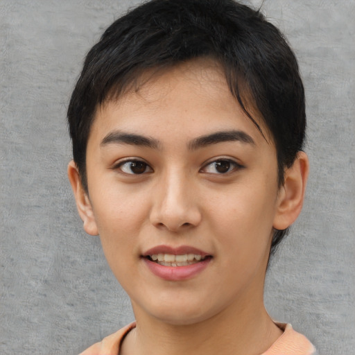 Joyful asian young-adult female with short  black hair and brown eyes