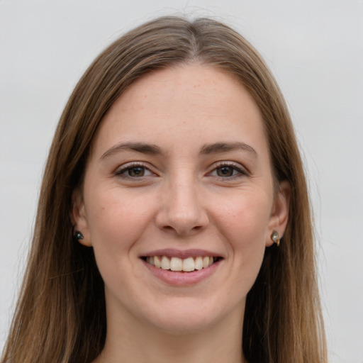 Joyful white young-adult female with long  brown hair and grey eyes