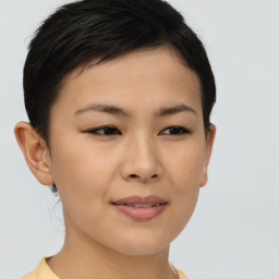 Joyful asian young-adult female with short  brown hair and brown eyes