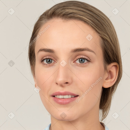 Joyful white young-adult female with medium  brown hair and blue eyes