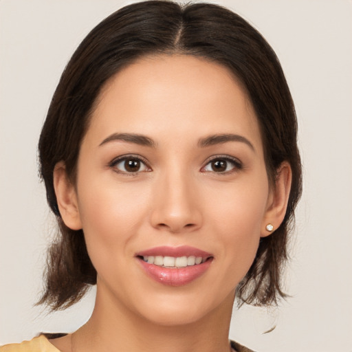 Joyful white young-adult female with medium  brown hair and brown eyes