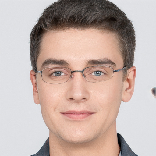 Joyful white adult male with short  brown hair and grey eyes