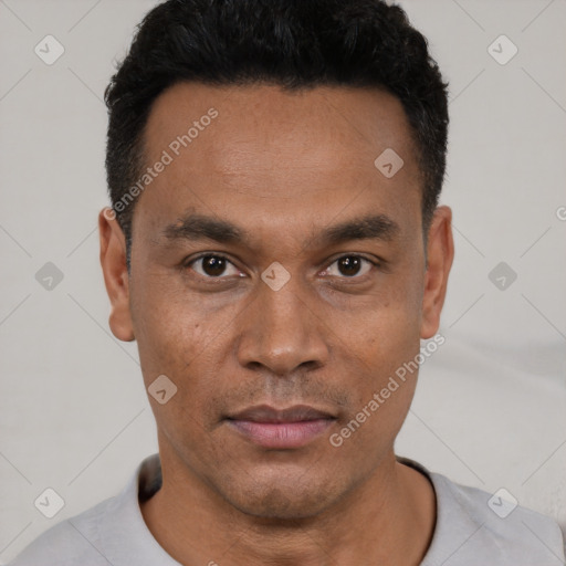 Neutral latino young-adult male with short  black hair and brown eyes