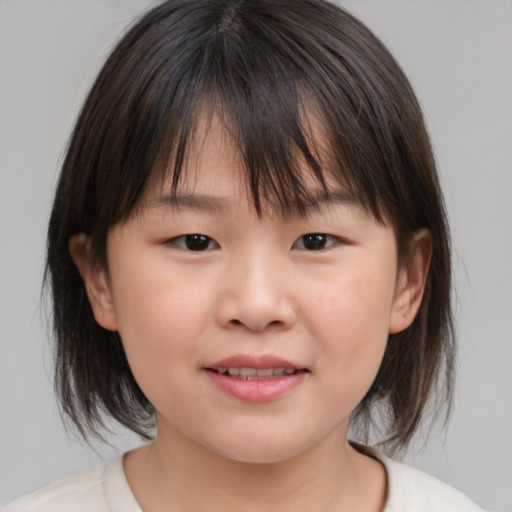 Joyful white child female with medium  brown hair and brown eyes