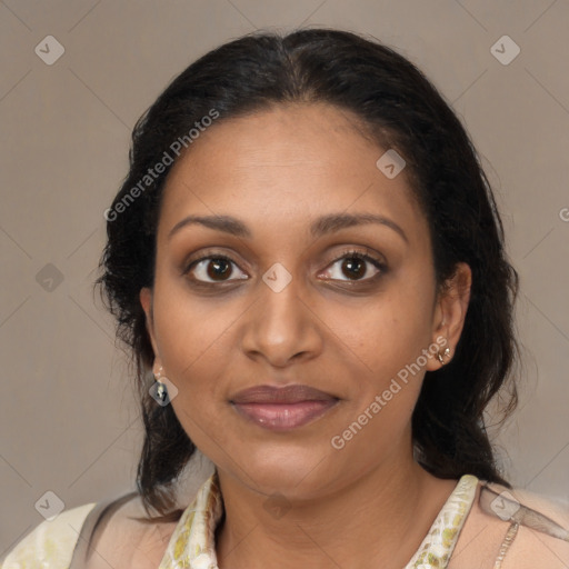 Joyful black adult female with medium  brown hair and brown eyes