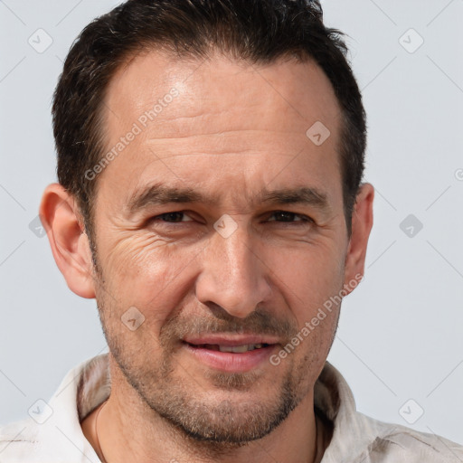 Joyful white adult male with short  brown hair and brown eyes