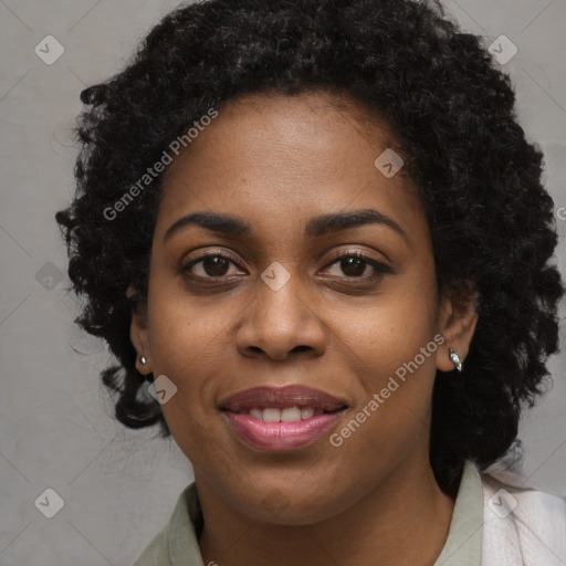 Joyful black young-adult female with long  brown hair and brown eyes