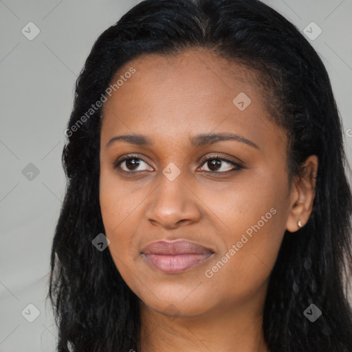 Joyful black young-adult female with long  black hair and brown eyes