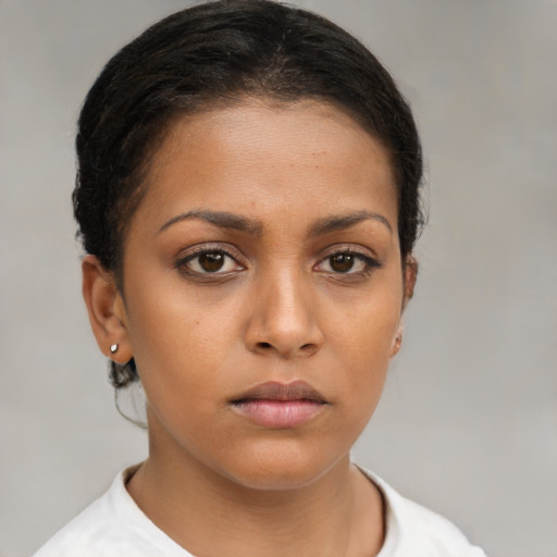 Neutral latino young-adult female with short  brown hair and brown eyes