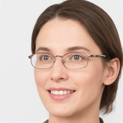 Joyful white young-adult female with medium  brown hair and green eyes