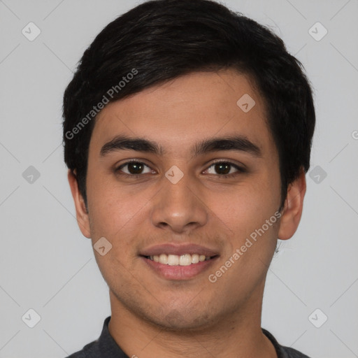 Joyful white young-adult male with short  black hair and brown eyes