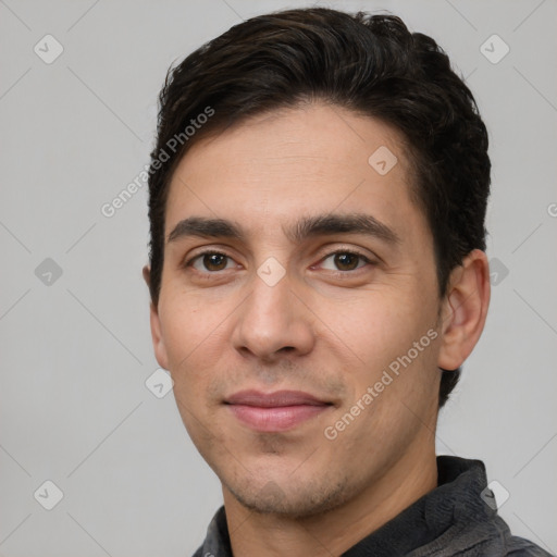 Joyful white young-adult male with short  black hair and brown eyes