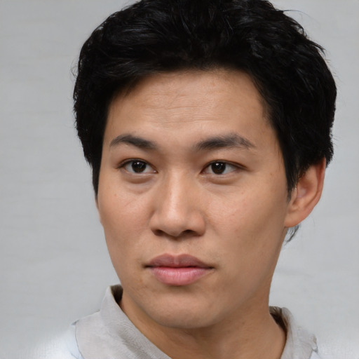 Neutral asian young-adult male with short  black hair and brown eyes