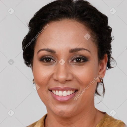 Joyful latino adult female with medium  brown hair and brown eyes