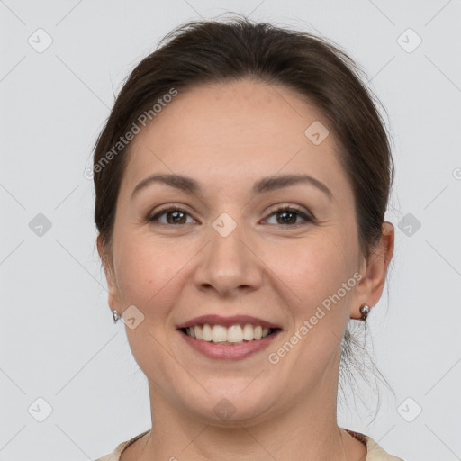 Joyful white young-adult female with medium  brown hair and grey eyes