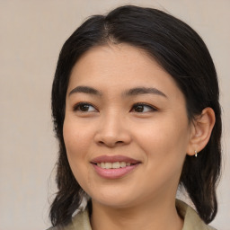 Joyful asian young-adult female with medium  brown hair and brown eyes