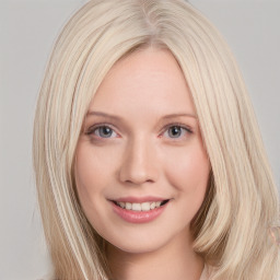 Joyful white young-adult female with long  brown hair and blue eyes