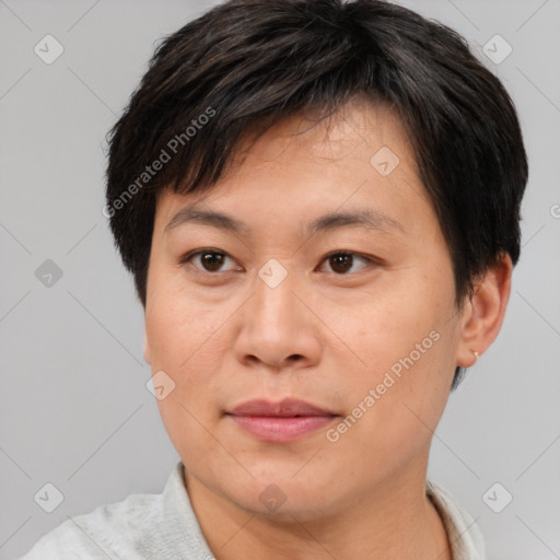 Joyful asian young-adult female with short  brown hair and brown eyes