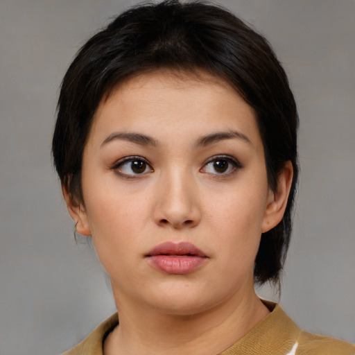 Neutral asian young-adult female with medium  brown hair and brown eyes