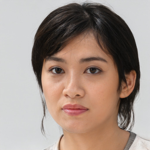 Neutral asian young-adult female with medium  black hair and brown eyes