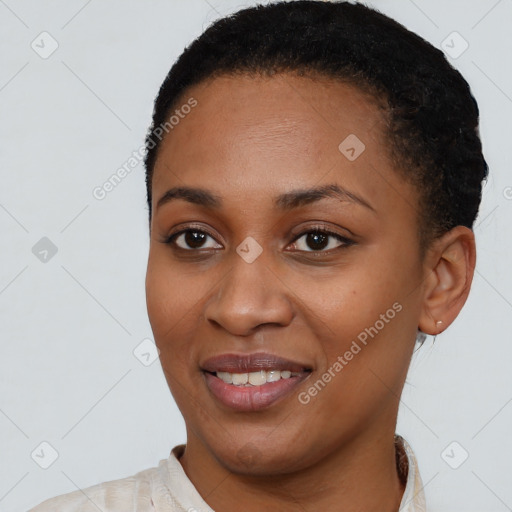 Joyful black young-adult female with short  black hair and brown eyes