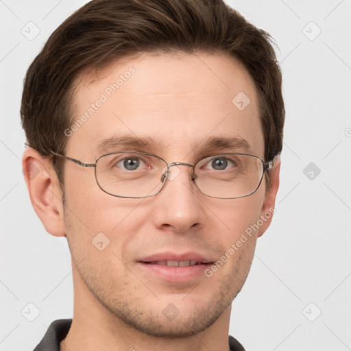 Joyful white adult male with short  brown hair and grey eyes