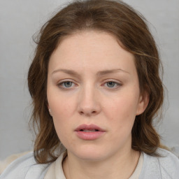 Neutral white young-adult female with medium  brown hair and blue eyes