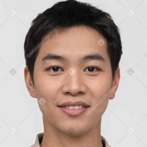 Joyful asian young-adult male with short  black hair and brown eyes