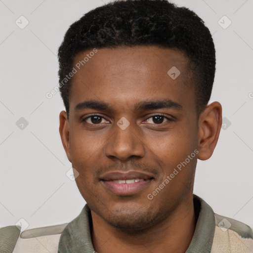 Joyful black young-adult male with short  black hair and brown eyes