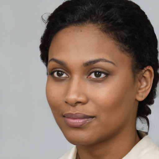 Neutral black young-adult female with short  brown hair and brown eyes
