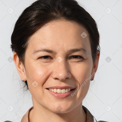 Joyful white adult female with medium  brown hair and brown eyes