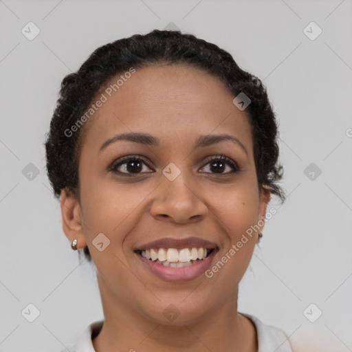 Joyful latino young-adult female with short  brown hair and brown eyes