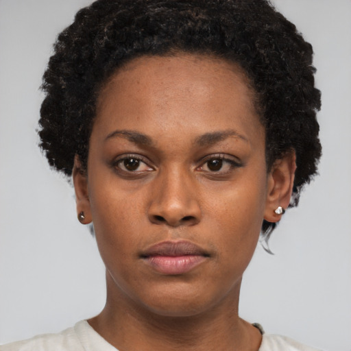 Neutral black young-adult female with short  brown hair and brown eyes