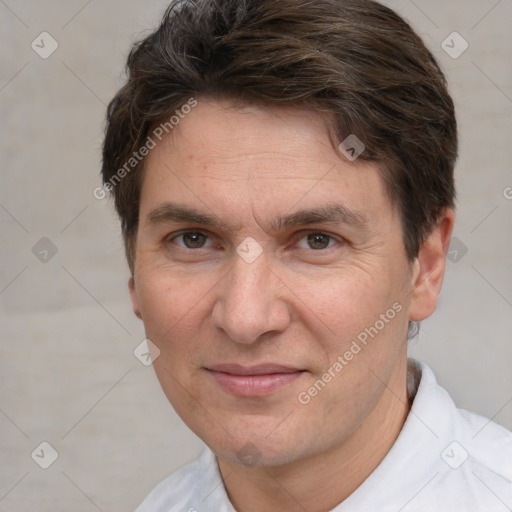 Joyful white adult male with short  brown hair and brown eyes