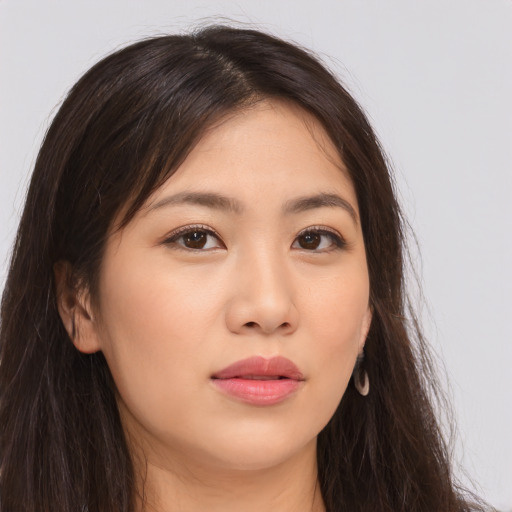 Neutral asian young-adult female with long  brown hair and brown eyes