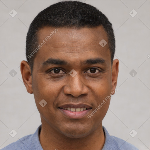 Joyful black young-adult male with short  black hair and brown eyes