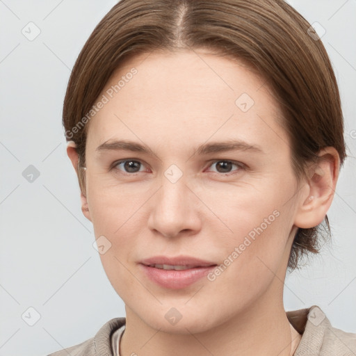 Joyful white young-adult female with short  brown hair and grey eyes