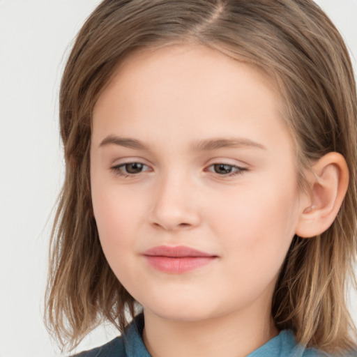 Joyful white child female with medium  brown hair and brown eyes