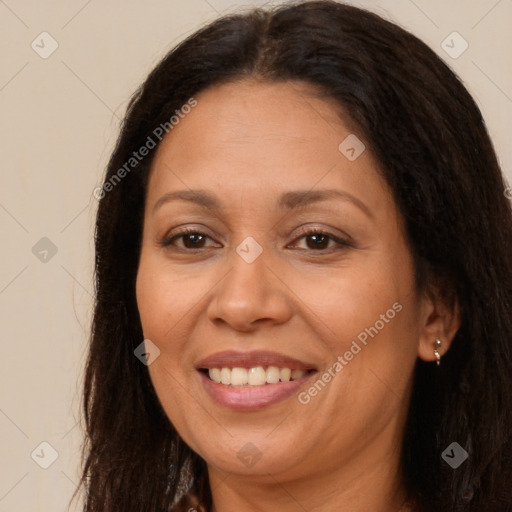 Joyful white adult female with long  brown hair and brown eyes