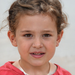 Joyful white child male with short  brown hair and brown eyes