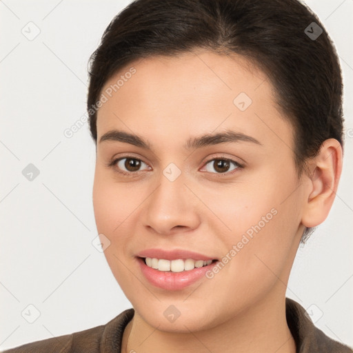 Joyful white young-adult female with short  brown hair and brown eyes