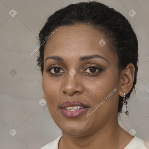 Joyful black young-adult female with short  brown hair and brown eyes