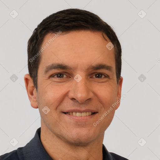 Joyful white adult male with short  brown hair and brown eyes