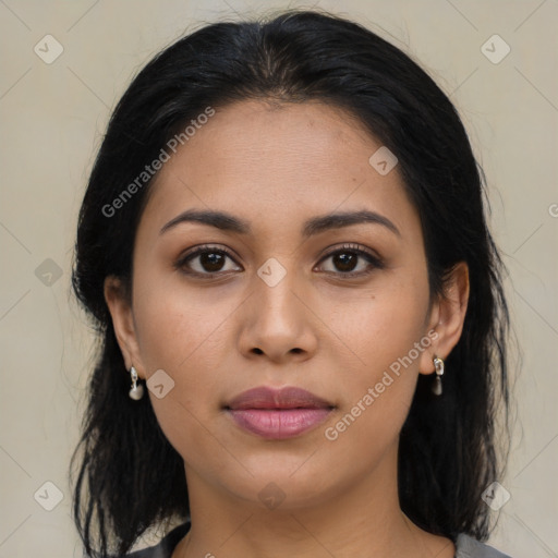 Joyful latino young-adult female with long  brown hair and brown eyes