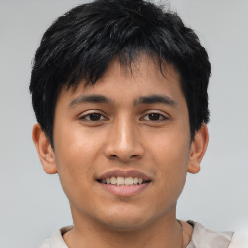 Joyful asian young-adult male with short  black hair and brown eyes