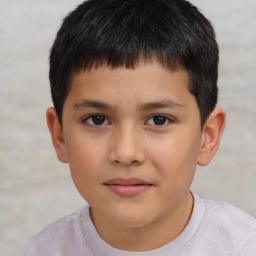 Joyful white child male with short  brown hair and brown eyes